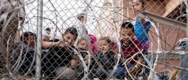 fenced in children at border